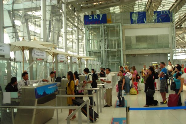 Passengers queuing at airport passport control