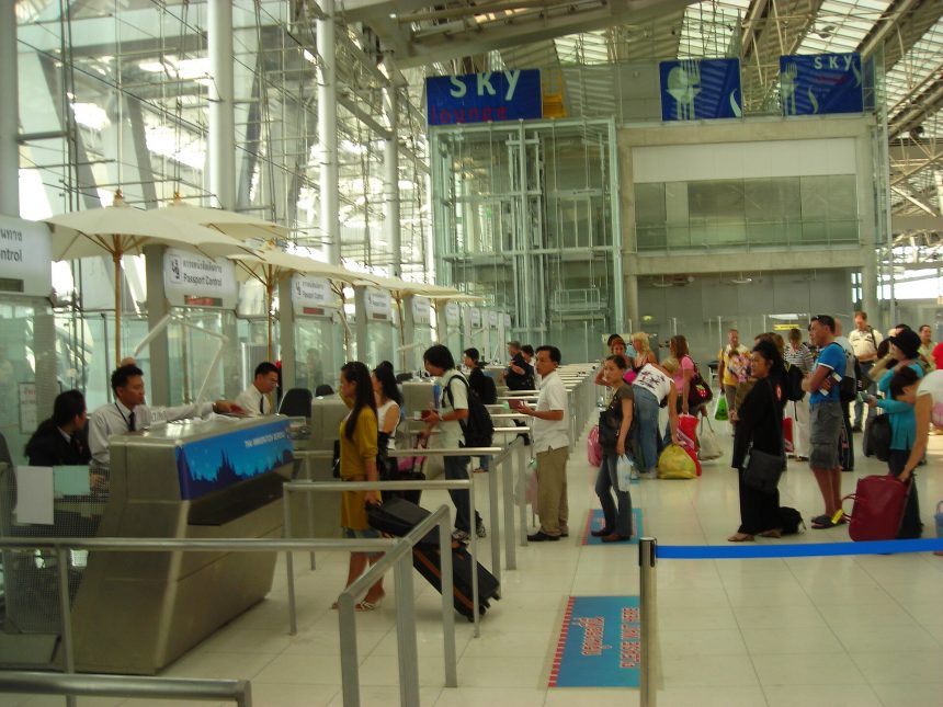 Passengers queuing at airport passport control