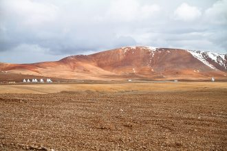 ALMA radio antennas on the Chajnantor Plateau in Chile at night